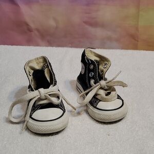 Toddler Converse Black and White High-Top Sneakers.